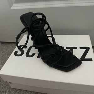 Brand new, black, lace-up heel